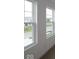 Two windows allow for natural light into a room with soft, neutral carpeting at 3917 Highcrest Rd, Indianapolis, IN 46239