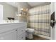 A bathroom featuring a vanity with bright countertops, a mirror, and a shower with a striped curtain at 422 W Broadway St, Greenwood, IN 46142