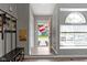 Welcoming entryway with natural light, coat rack, and view of the front yard at 422 W Broadway St, Greenwood, IN 46142
