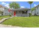 Inviting gray home with a well-maintained lawn and quaint front porch at 422 W Broadway St, Greenwood, IN 46142