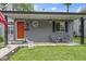 Cozy front porch with seating area and cheerful flower accents at 422 W Broadway St, Greenwood, IN 46142