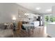 Bright kitchen featuring white cabinets, stainless steel appliances, and an adjacent dining area at 422 W Broadway St, Greenwood, IN 46142