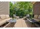 Relaxing back porch with comfortable seating and a view of the lush backyard at 4529 Panthera Leo Dr, Carmel, IN 46074