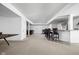 Finished basement offering a bar area with stools, alongside a separate living space with leather furniture at 4529 Panthera Leo Dr, Carmel, IN 46074