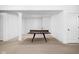 Spacious basement with a ping pong table in the center, showcasing a recreational area at 4529 Panthera Leo Dr, Carmel, IN 46074