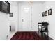 Bright foyer featuring a white front door, dark wood floors with an oriental rug, and a small bench at 4529 Panthera Leo Dr, Carmel, IN 46074