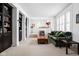 Inviting living room with built-in bookshelves, plush seating, and neutral carpeting at 4529 Panthera Leo Dr, Carmel, IN 46074