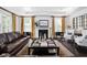 Bright living room featuring a fireplace, hardwood floors, and stylish furnishings at 4529 Panthera Leo Dr, Carmel, IN 46074