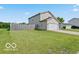 Spacious backyard with a well-kept lawn and wooden fence at 4605 Clairmont Dr, Columbus, IN 47203