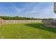 Expansive, well-maintained backyard, enclosed by a high wooden fence for privacy and security at 4605 Clairmont Dr, Columbus, IN 47203