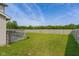 Large, grassy backyard with a full wooden fence, providing ample space and privacy at 4605 Clairmont Dr, Columbus, IN 47203