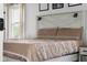Inviting bedroom with a patterned bedspread, modern headboard, and ample natural light at 4605 Clairmont Dr, Columbus, IN 47203