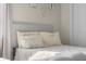 Bright bedroom featuring a bed with decorative pillows and neutral colored walls at 4605 Clairmont Dr, Columbus, IN 47203