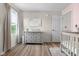 Bright Bedroom with a white dresser and decorative accents, illuminated by natural light at 4605 Clairmont Dr, Columbus, IN 47203