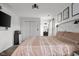 Bright bedroom with patterned bedspread, TV, and easy access to an en-suite bathroom at 4605 Clairmont Dr, Columbus, IN 47203