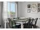 Dining room with natural light and table set for eight at 4605 Clairmont Dr, Columbus, IN 47203