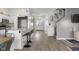 Open concept kitchen area leading into a cozy dining and living space with modern furnishings at 4605 Clairmont Dr, Columbus, IN 47203