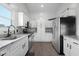 Spacious kitchen with stainless steel appliances, granite countertops and white cabinets at 4605 Clairmont Dr, Columbus, IN 47203