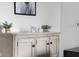 The rustic cabinet with decorative accents enhances the cozy atmosphere of the well-decorated home office at 4605 Clairmont Dr, Columbus, IN 47203