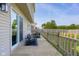 Covered patio with seating area and sliding glass door that blends indoor/outdoor living at 4605 Clairmont Dr, Columbus, IN 47203