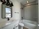 Modern bathroom with gray subway tile, and white single vanity at 473 Mariposa Trl, Carmel, IN 46032