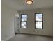 Neutral bedroom with carpet, windows, and minimalist finishes at 473 Mariposa Trl, Carmel, IN 46032