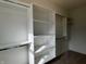 Spacious walk-in closet with custom white shelving and ample storage space at 473 Mariposa Trl, Carmel, IN 46032