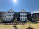 Inviting exterior view of new townhome with professional landscaping and craftsman style architecture at 473 Mariposa Trl, Carmel, IN 46032