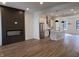 Open concept living and kitchen area with fireplace, island, and stainless steel appliances at 473 Mariposa Trl, Carmel, IN 46032