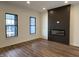 Living room featuring a fireplace and luxury vinyl flooring at 473 Mariposa Trl, Carmel, IN 46032