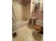 Modest bathroom with a tub, single pedestal sink, and a wood-seat toilet at 4931 Orion Ave, Indianapolis, IN 46201