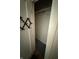 Small closet with a coat rack and grey carpet at 4931 Orion Ave, Indianapolis, IN 46201