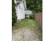 Driveway and yard leading to a detached garage in the backyard at 4931 Orion Ave, Indianapolis, IN 46201