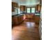 Spacious kitchen with oak cabinets, cooktop, and plenty of counter space at 4931 Orion Ave, Indianapolis, IN 46201