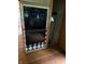 Black oven unit framed with patterned trim and hardwood floors at 4931 Orion Ave, Indianapolis, IN 46201