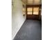 Enclosed sun room with neutral carpet and unique wall texture, perfect for relaxing at 4931 Orion Ave, Indianapolis, IN 46201