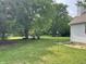 Expansive backyard with lush greenery and a cozy seating area at 530 Denny Dr, Mooresville, IN 46158