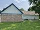 Exterior shot showcasing a home's siding, brick, and roof with greenery at 530 Denny Dr, Mooresville, IN 46158