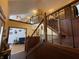 Open foyer with hardwood floors, wooden staircase, and stone accents at 530 Denny Dr, Mooresville, IN 46158
