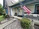 Inviting front porch with American flag, landscaping, and decorative accents at 530 Denny Dr, Mooresville, IN 46158