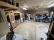 Spacious garage showcasing ample storage, a motorcycle, refrigerator and workspace at 530 Denny Dr, Mooresville, IN 46158