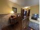 Spacious hallway featuring hardwood floors, accent wall, and staircase at 530 Denny Dr, Mooresville, IN 46158