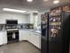 Updated kitchen features modern appliances, white cabinets, and subway tile backsplash at 530 Denny Dr, Mooresville, IN 46158