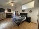 Large main bedroom featuring a wood burning fireplace, mounted TV, and vaulted ceilings at 530 Denny Dr, Mooresville, IN 46158