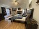 Spacious main bedroom featuring a king bed, fireplace, and a vaulted ceiling with a fan at 530 Denny Dr, Mooresville, IN 46158