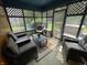 Inviting sunroom featuring comfortable seating, natural light, and an open view of the backyard at 530 Denny Dr, Mooresville, IN 46158