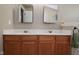 Large bathroom showcasing double sinks with wood cabinets and framed mirrors at 5456 Reston Dr, Plainfield, IN 46168