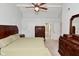 Spacious bedroom featuring light-colored walls, dark wood furniture and access to an ensuite bath at 5456 Reston Dr, Plainfield, IN 46168