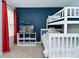 Bedroom includes a bunk bed with a modern display case and a red curtain at 5456 Reston Dr, Plainfield, IN 46168
