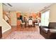 An open concept living room, dining area, and kitchen features hardwood floors and ample space at 5456 Reston Dr, Plainfield, IN 46168
